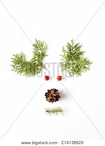 Reindeer Face from natural materials. Christmas deer silhouette picture in minimalistic design concept