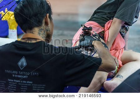 Tattoo Artist Drawing Art On Body