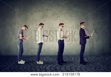 Young man with laptop computer growing older succeeding in his career