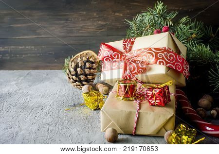 Red Christmas  Gift  Box With Red Ribbon And Fir Branches