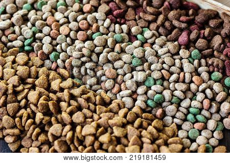 Dry pet food background - three kinds. Meat.