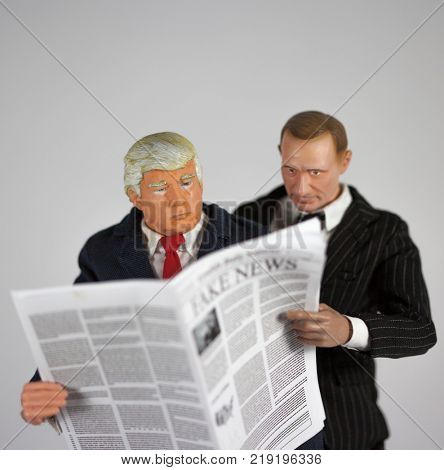 Caricature of United States President Donald Trump and Russian President Vladimir Putin reading Fake News
