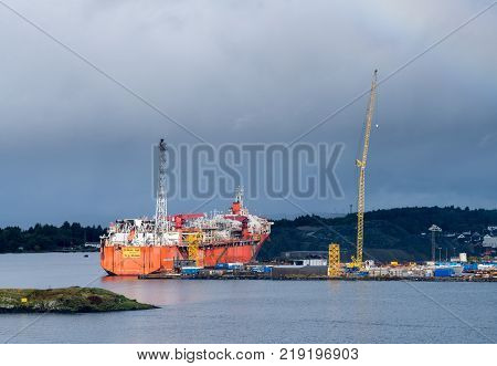 STAVANGER, NORWAY - SEPTEMBER 20, 2017: Oil rig construction ship Petrojarl Varg docked in Stavanger Harbor.