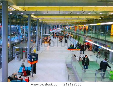 Cologne, Germany - December 12, 2017: The people going at Cologne Bonn Airport at Cologne, Germany on December 12, 2017.