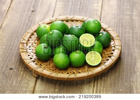 sudachi, japanese citrus fruit, is served as garnish with many traditional japnaese dishes