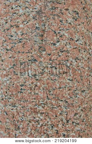 Facing material red granite texture. Natural stone granite background texture. Bright hard red granitic rock texture. Red granite granitic stone background texture. Red granite untreated surface.