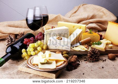 various types of cheese on rustic wooden table