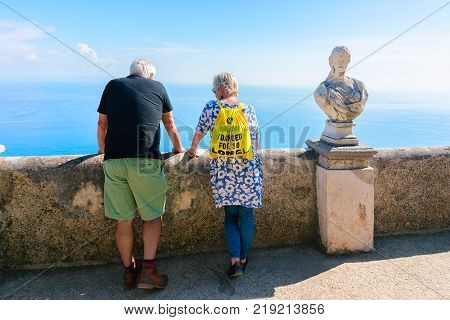 Ravello Italy - October 2 2017: Senior people looking at the sea in the terrace in Ravello village Tyrrhenian sea Amalfi coast Italy autumn