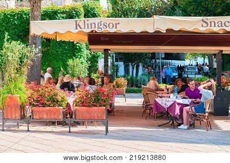 Ravello Italy - October 2 2017: People at street restaurant on central square of Ravello village Tyrrhenian sea Amalfi coast Italy