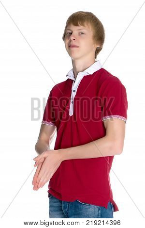 A young red-haired guy in a shirt and jeans. Isolated on white background.