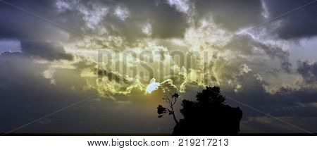 Dramatic sunrise over the Adriatic Sea with Kamen Brela - Tiny famous island in Brela, Makarska Riviera, Croatia
