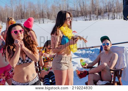 Novokuznetsk, Kemerovo region, Russia - 23 Feb, 2017 : White beaches of Siberia is an enterteiment activity where people playing beach games dressed in bikini in winter. Beach party in winter time