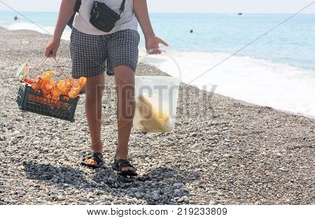 The seller of chips and corn on the Abkhazian beach - Gagra 2017