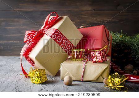 Red Christmas  Gift  Box With Red Ribbon And Fir Branches