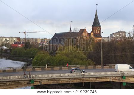KALININGRAD, RUSSIA - APRIL 25, 2016: View of the gothic Konigsberg Cathedral and the Overpass bridge over the Pregolya River. The Cathedral (was built in the 14th century) located on Kneiphof island.
