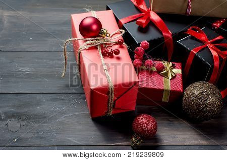 Red Christmas  Gift  Box With Red Ribbon And Fir Branches