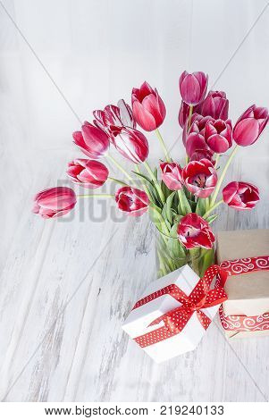 Red Christmas  Gift  Box With Red Ribbon And Fir Branches