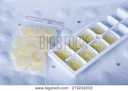 Frozen grated ginger in the freezer. Freezing food.