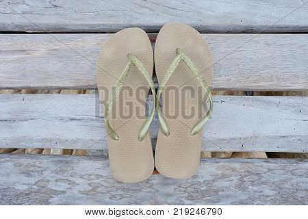 light brown sandals on wooden bridge for summer