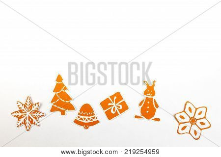 Gingerbread cookies over white background. Top view with. with copy space.