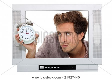 Muž v televizi s budíkem