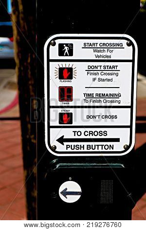 Traffic light button.Use traffic lights at the crossroads. Button of the mechanism lights traffic lights on the street. System control traffic light intersection close.