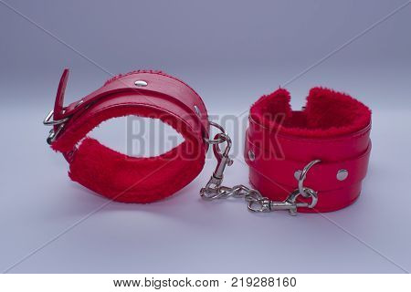 Bondage Sadomasochism sex games erotic handcuffs for sex. Handcuffs on a gray background