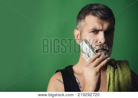 Man Cut Beard And Mustache With Razor And Shaving Gel.