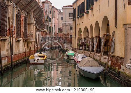 Typical view of the narrow side of the canal, Venice, Italy. Communication in the city is done by water, which creates a network of 150 channels interconnected. Nobody here. Photo from the water level.