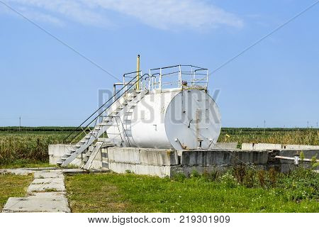 Reservoir For Sludge Of Oil Emulsion. Equipment At The Oil Field