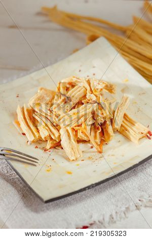 Yuba or fuju salad in a white bamboo plate