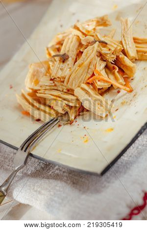 Yuba or fuju salad in a white bamboo plate