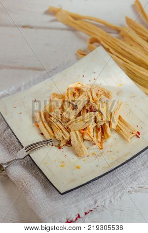 Yuba or fuju salad in a white bamboo plate
