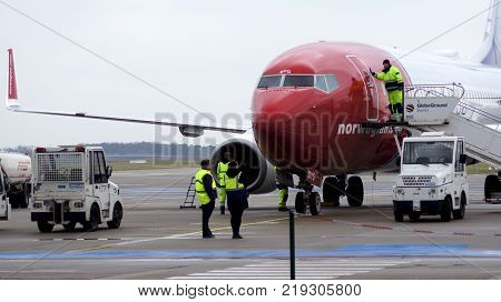 BERLIN, GERMANY - JAN 17th, 2015: Norwegian Boeing 737 airplane arriving at the gate in Berlin Schonefeld airport SXF.