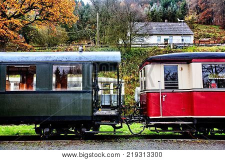 Old german railroad passenger wagons in autumn view