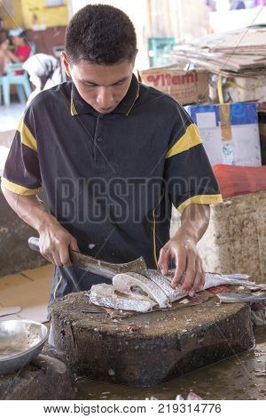 Labuanbajo Indonesia - August 18 2015: Photo from traditional exotic tribal market in Indonesia Fish seller Indonesia