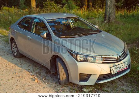 Moscow, Russia - August 18, 2017: Toyota Corolla parked in the nature forest. Introduced in 1966 the Corolla was the best-selling car worldwide by 1974 and has been one of the best-selling cars in the world since then.