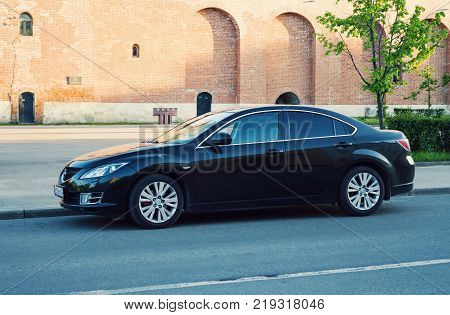 Smolensk, Russia - June 08, 2017: New black Mazda 6 (Atenza) parked on the street of ancient old russian town Smolensk. The Mazda6 has sold over one million units worldwide since its introduction hitting this sales milestone faster than all previous Mazda