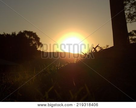 The sun goes down about the mountain