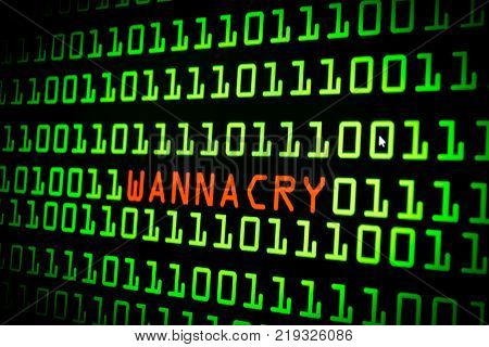 The Wannacry And Binary Code Concept On The Desktop Screen. Wannacry Ransomware Attack On Desktop Sc