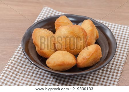 Chinese fried Dough bun on wooden plate