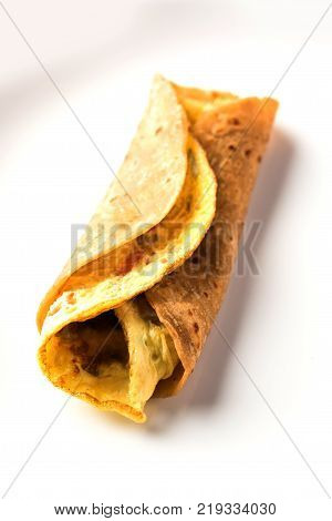 omelette / omelette chapati roll or Indian bread or roti rolled with omlet. Popular, quick and healthy recipe for kid's tiffin or lunch box
