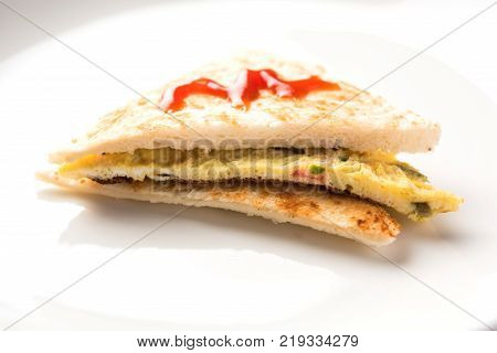Indian Bread omelette / omlet / omlete sandwich served with tomato ketchup