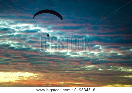 Sunset At The Beach With Tourists Enjoying