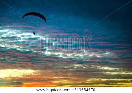 Sunset At The Beach With Tourists Enjoying