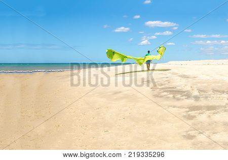 Sunset At The Beach With Tourists Enjoying