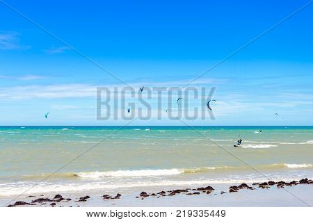 Sunset At The Beach With Tourists Enjoying