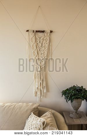 Macrame Wall Art Hanging In The Beige Interior In Beige Interior Hanging Over Sofa With Green Plant 