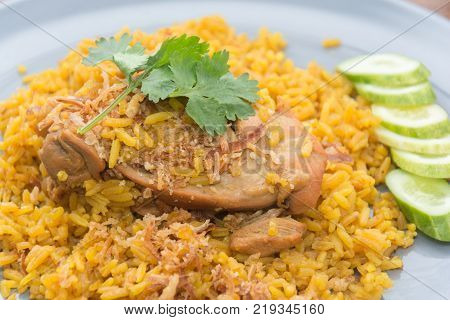 Chicken Biryani with rice and sauce. halal food (Khao Mok Gai)