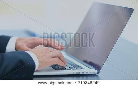 Person Typing on a modern laptop